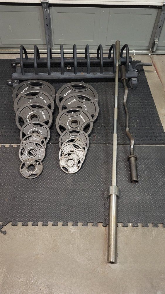 Weights 255 pounds plus barbells