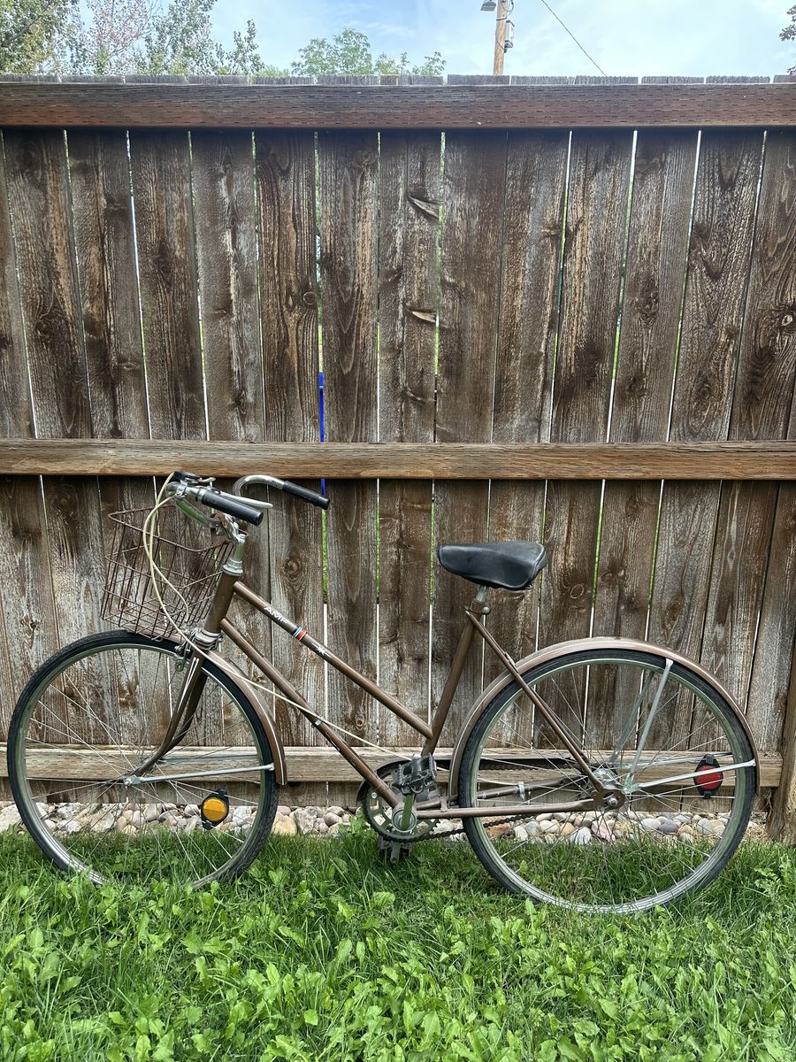 Vintage AMF step-through bicycle with basket - flat tires