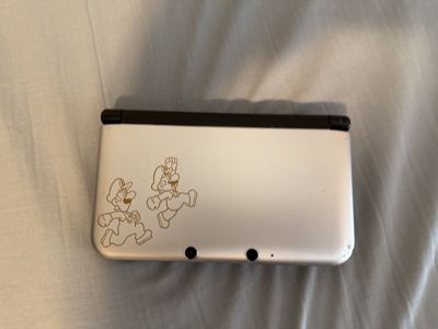 Modded Mario and Luigi edition Nintendo 3ds XL comes with charger.