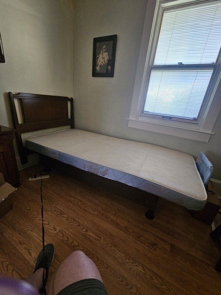 Adjustable twin bed frame, no mattress.