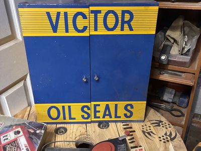 Vintage Victor Oil Seals Metal Display Cabinet with Automotive Seals