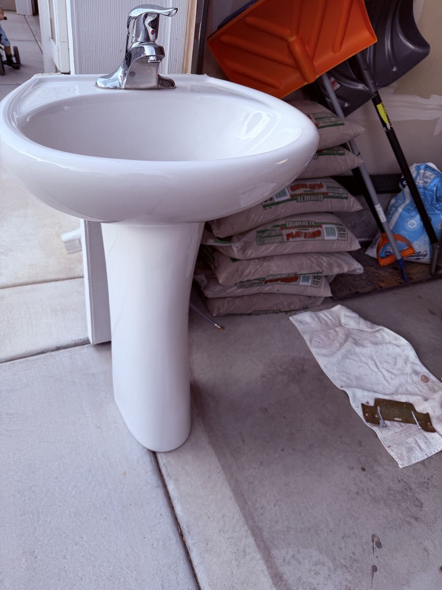 White Porcelain Pedestal Sink with Chrome Faucet