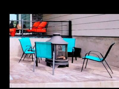 patio set with free standing fire pit and 6 chairs and small side table -LIKE NEW!