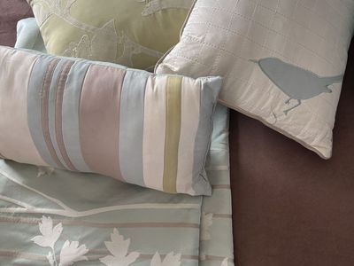 Assorted Decorative Pillows and Fabric Set with Floral and Bird Motifs