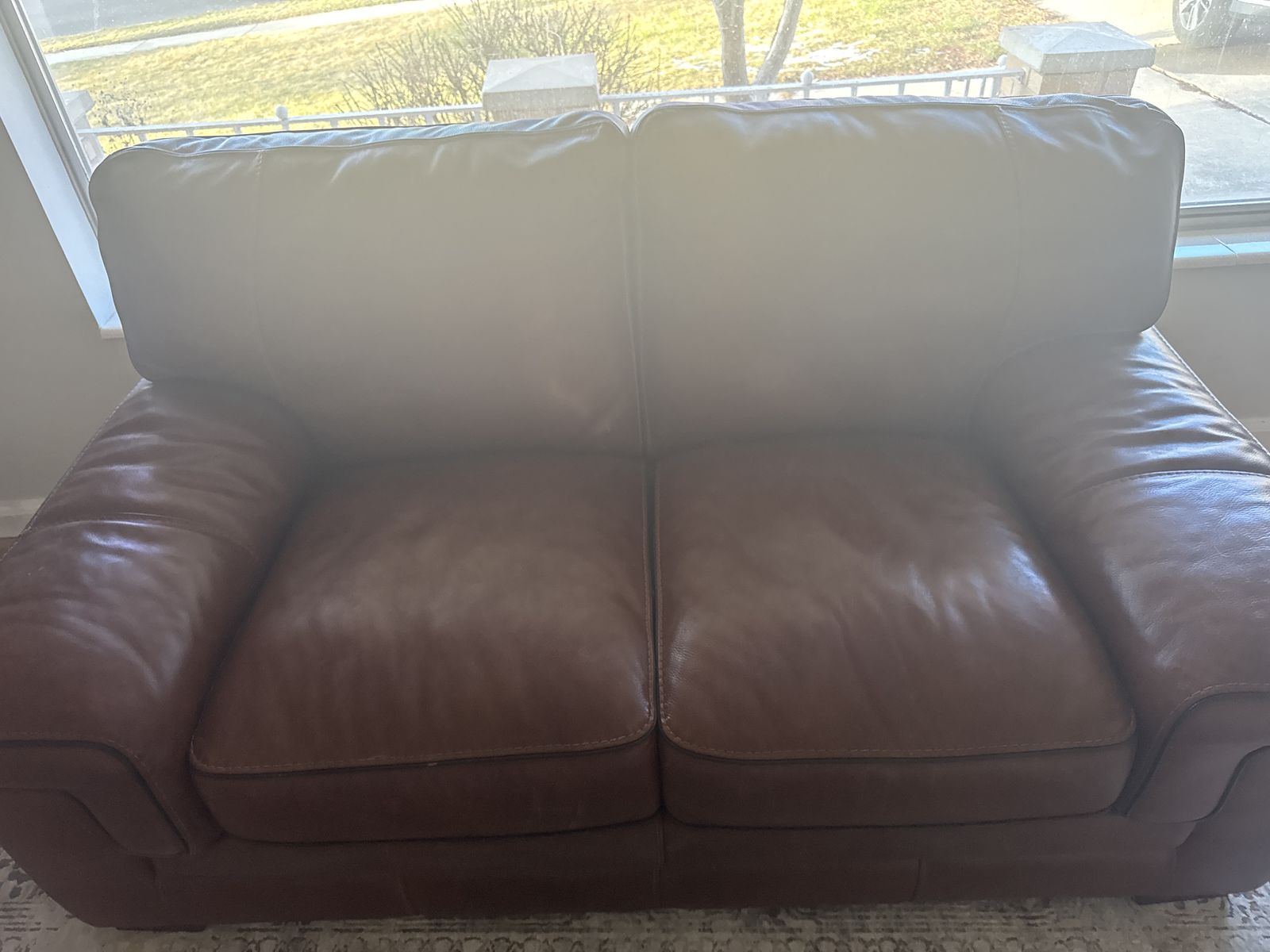 Leather Love Seat.