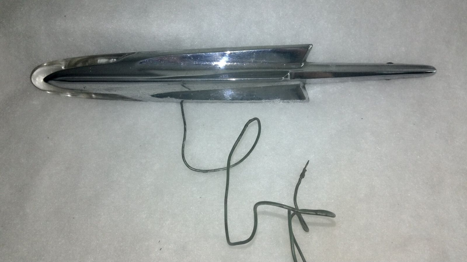 Vintage lighted front fender and/or hood ornament for a 1957 Pontiac Ex Condition w/org wiring harness