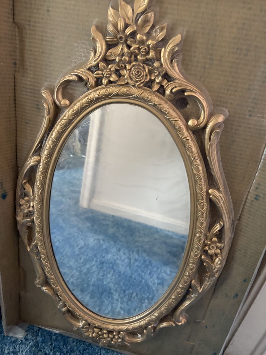 Vintage ornate gold-colored mirror