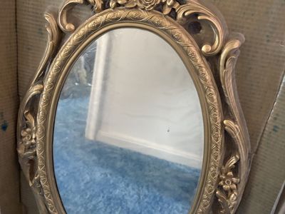 Vintage ornate gold-colored mirror