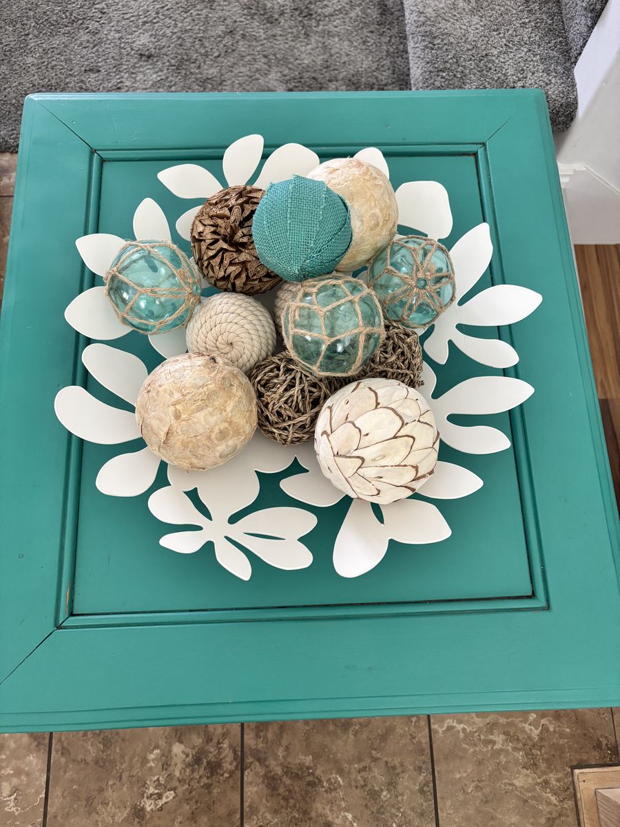 Turquoise wood end table with decor