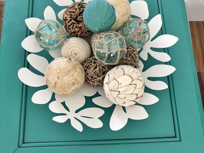 Turquoise wood end table with decor