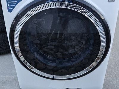 GE 4.8 cu ft. front load washer. Needs bearings