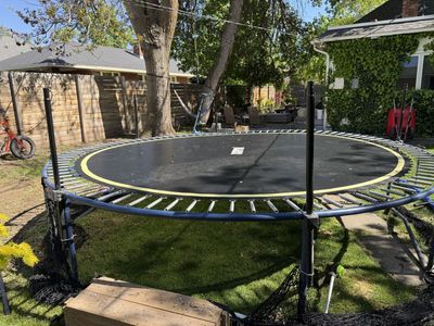 14 foot Heavy Duty trampoline and netting.