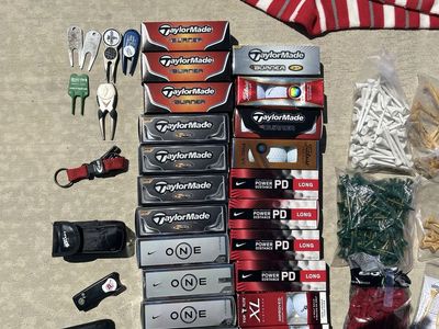 Assorted golf supplies and new golf balls
