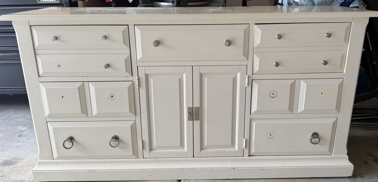 Cream colored dresser and nightstand