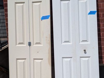 Pair of Used Bi-Fold Closet Doors - White/Off-White, 23.5" x 78.75" each