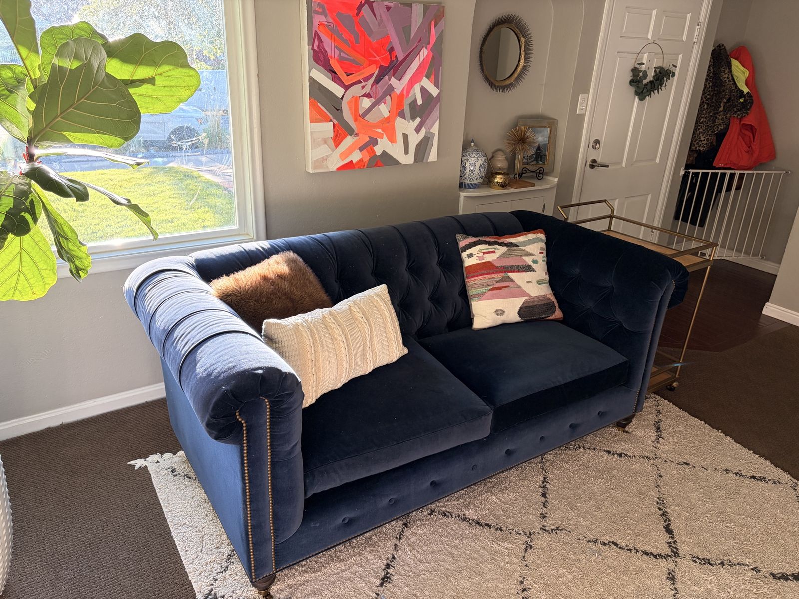 Anthropologie navy velvet tufted sofa with nailhead trim