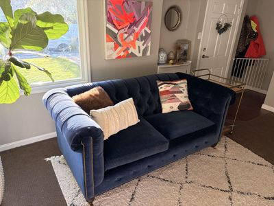 Anthropologie navy velvet tufted sofa with nailhead trim
