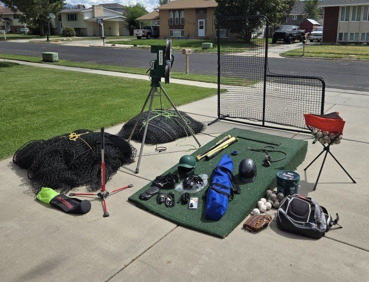ATEC Casey Pro Baseball Pitching Machine Training Bundle with Batting Cage Nets and other items.
