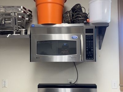 GE Profile Spacemaker Over-the-Range Stainless Steel Microwave