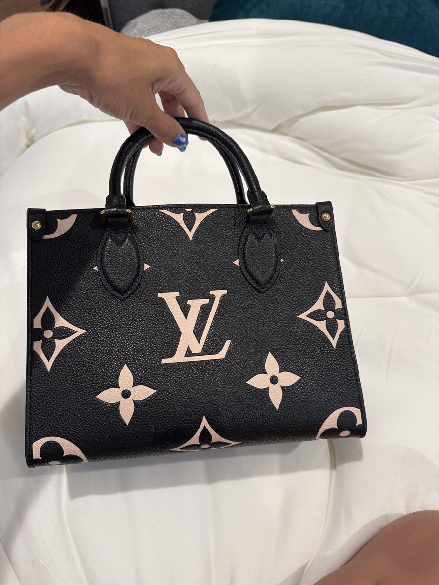 Louis Vuitton on the go mini, black-and-white embossed.