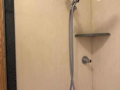 Corian shower surround.