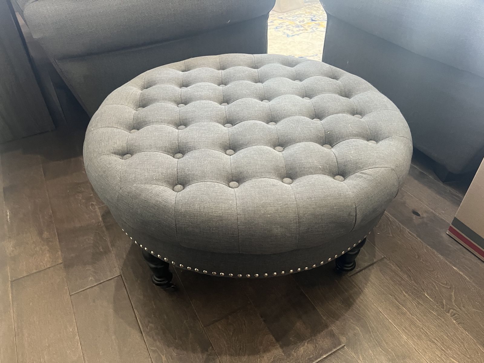 Grey tufted ottoman