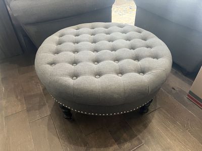 Grey tufted ottoman