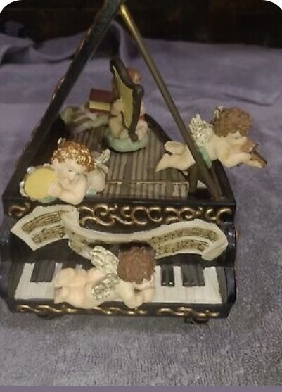 Moving Cherub on Piano Box