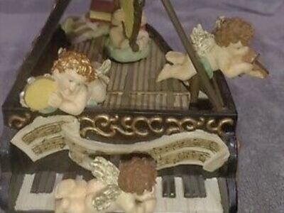 Moving Cherub on Piano Box