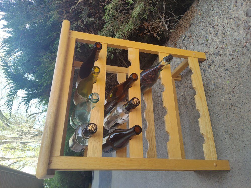 Small wine rack with glass bottles