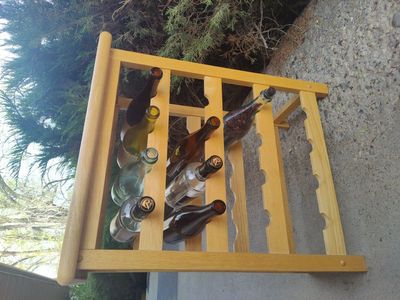 Small wine rack with glass bottles