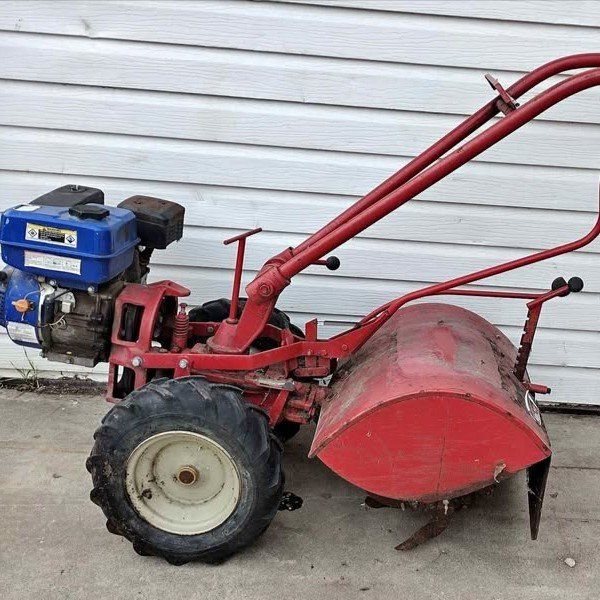 Troy Bilt Tiller with a 5HP  engine. Runs, but