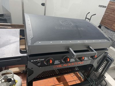 36 inch 4 burner Blackstone griddle with stand and bottom storage shelves
