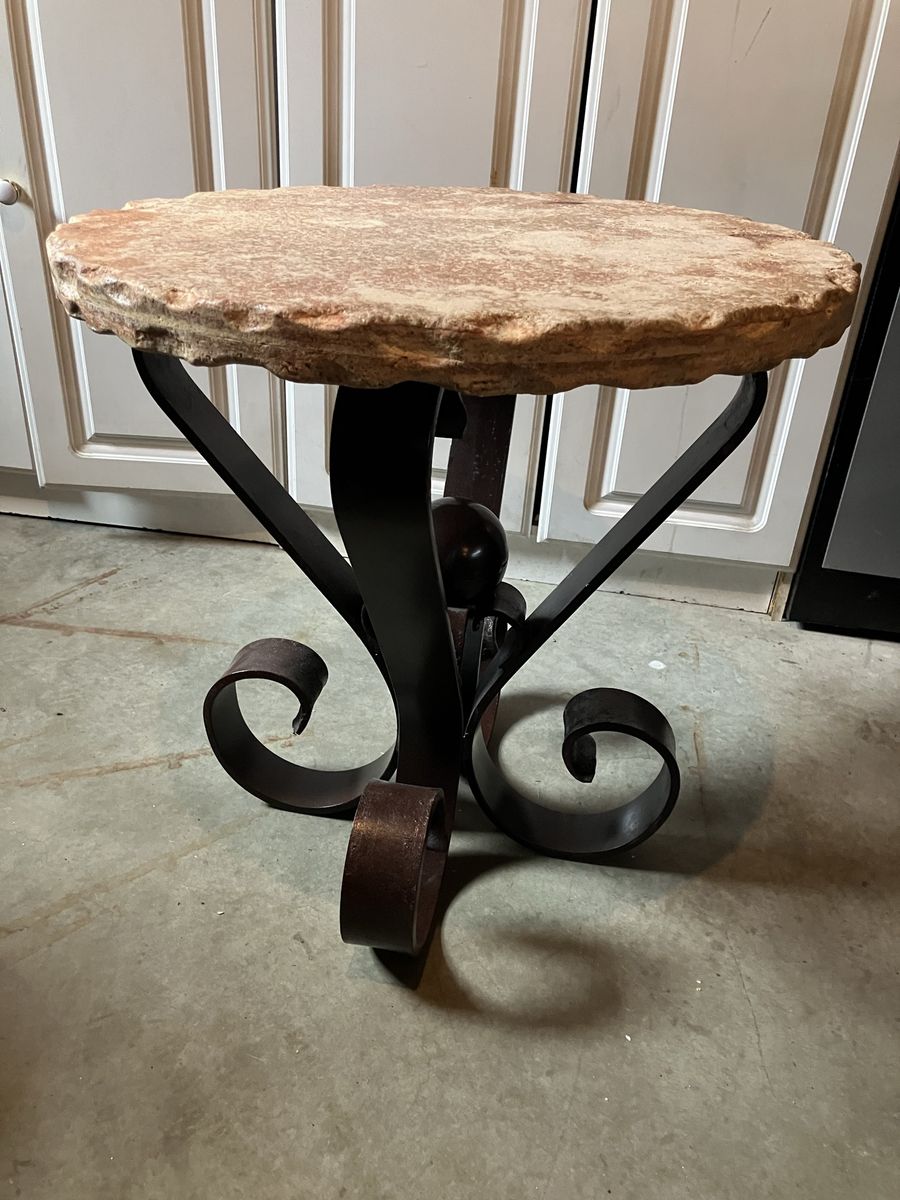 Scalloped edge stone top wrought iron base table