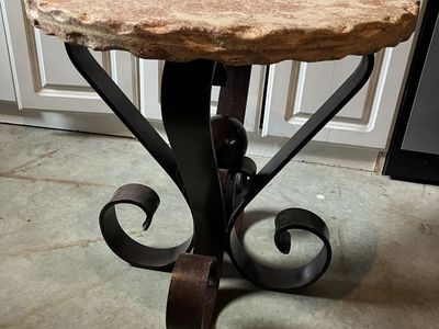 Scalloped edge stone top wrought iron base table