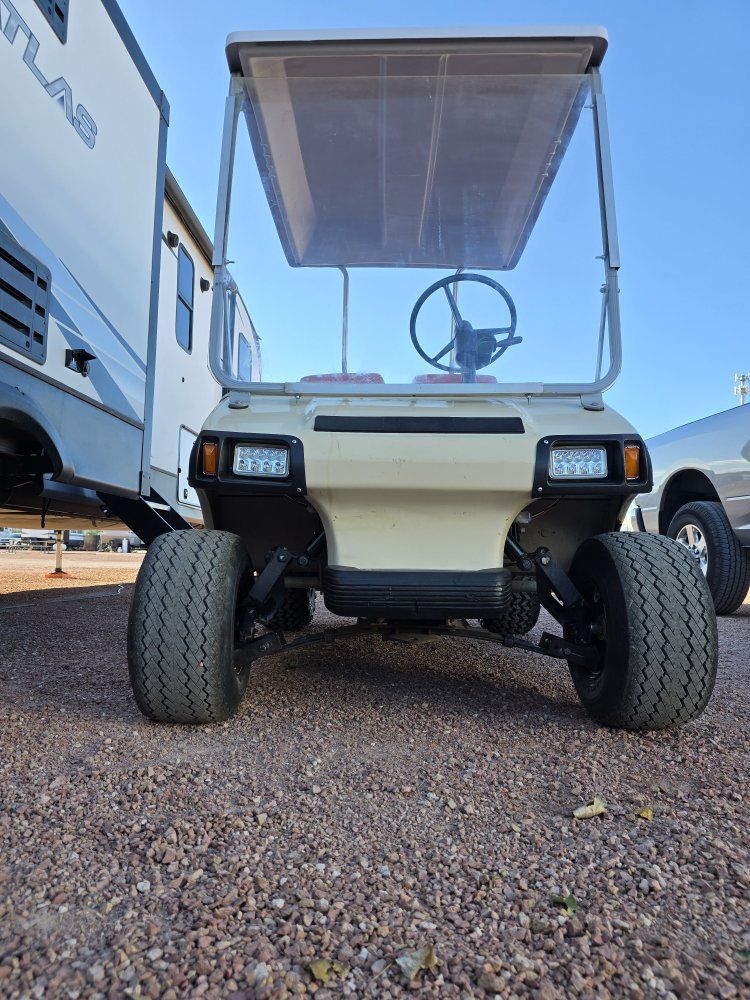 Golf cart and trailer.