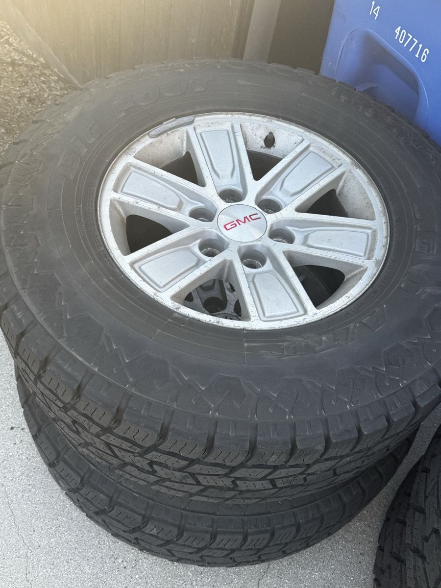 GMC OEM Silver Alloy Wheels with Big O Big Foot A/T Tires + steel rim spare new