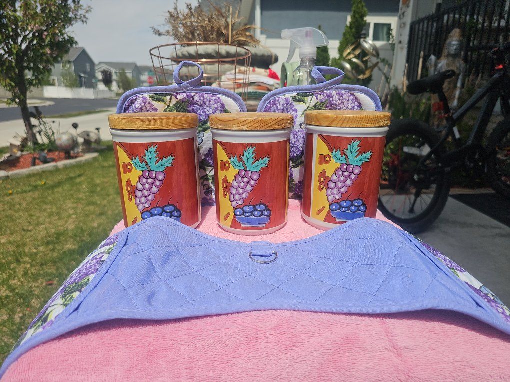 Vintage grape-themed kitchen canister set with mat