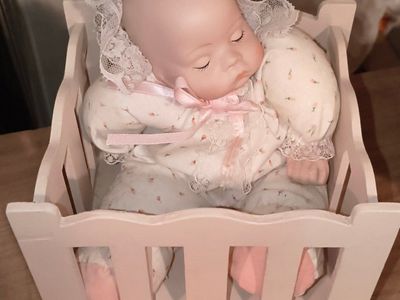 Porcelain Sleeping Baby Doll in Pink Wooden Crib Musical Box