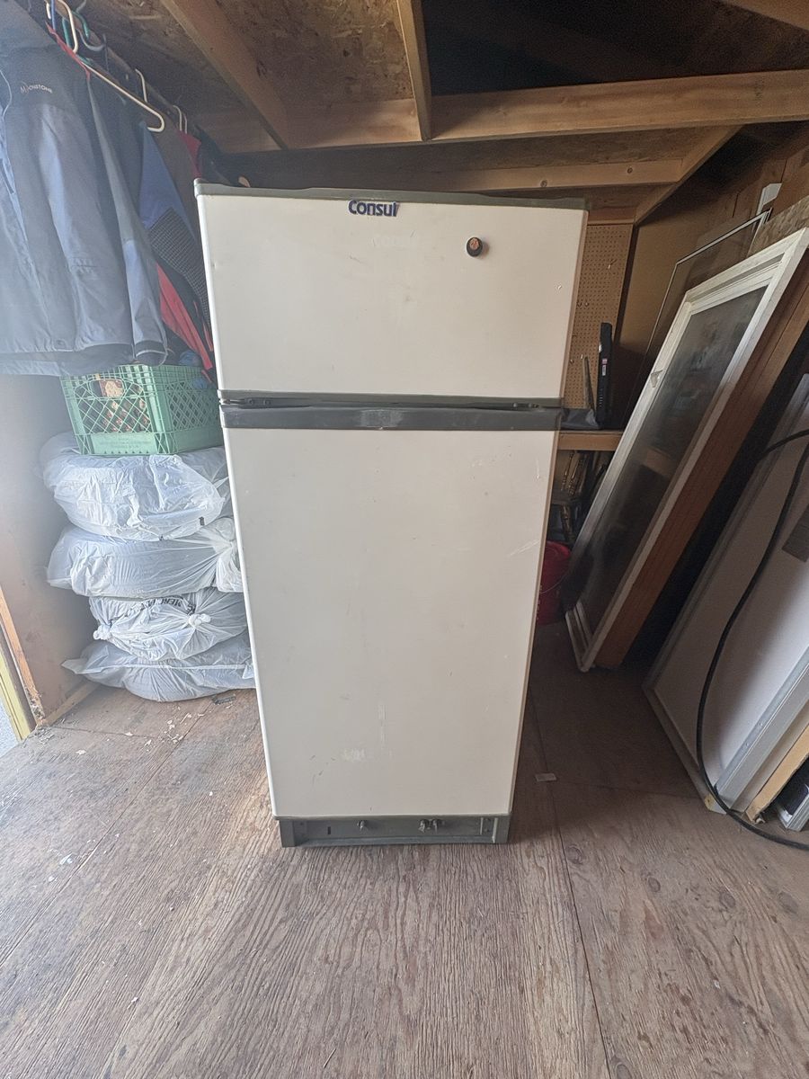 Propane refrigerator.