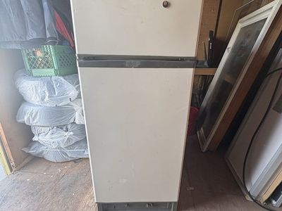 Propane refrigerator.