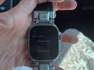 Apple Watch Ultra GPS + Cellular 49mm Titanium Case Smart Watch with Black Leather band