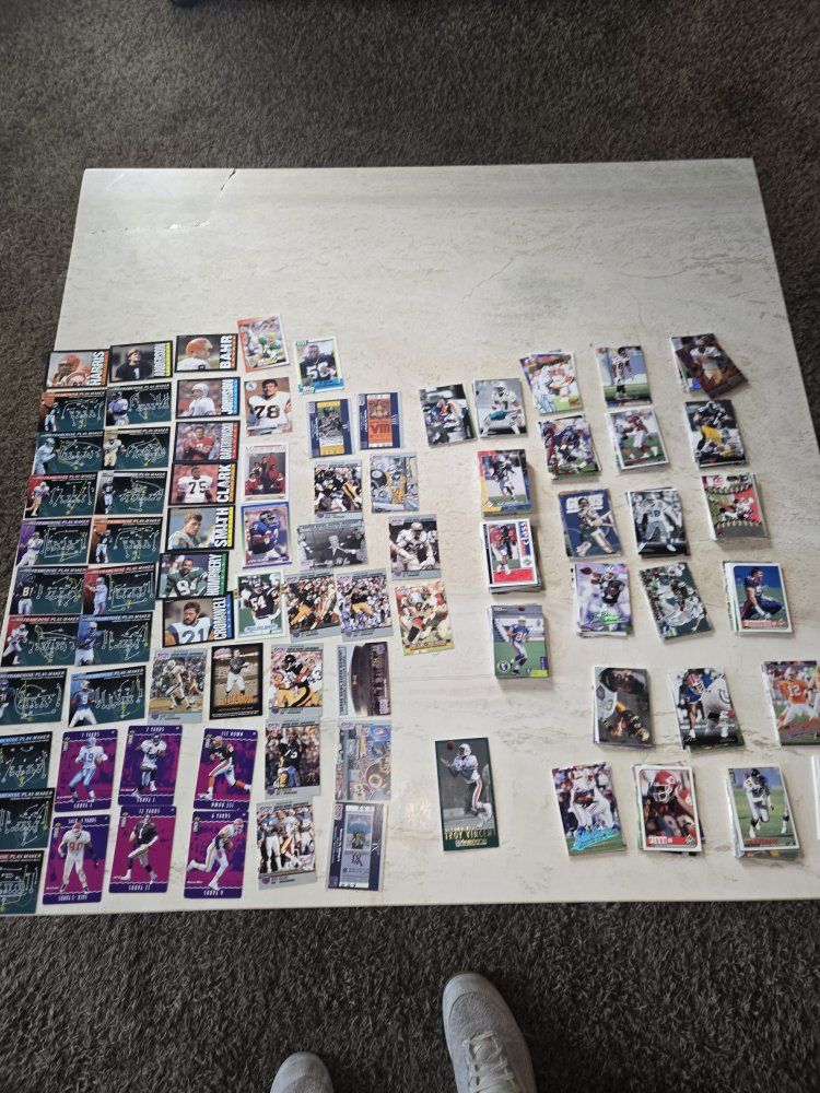 lot of 300+ football cards from 80s and 90s.  over 90 rookie cards.  inserts, hall of famers.  good cond.