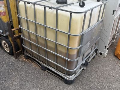 Used oil container. Industrial Bulk Liquid Storage Container IBC Tote with Metal Cage & Pallet Base