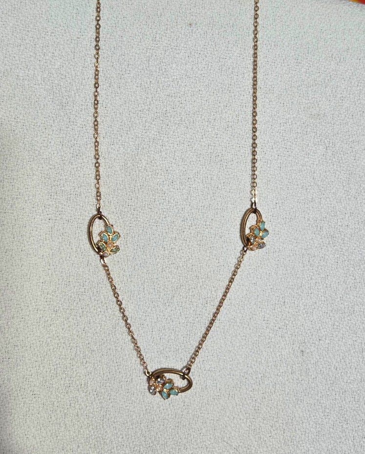 Gold Tone Time and True Chain Necklace with Floral Crystal and Blue Stone Stations