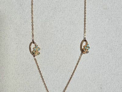 Gold Tone Time and True Chain Necklace with Floral Crystal and Blue Stone Stations