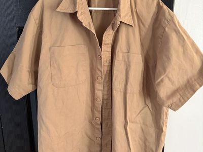 Tan sheet sleeved Jesse James shirt