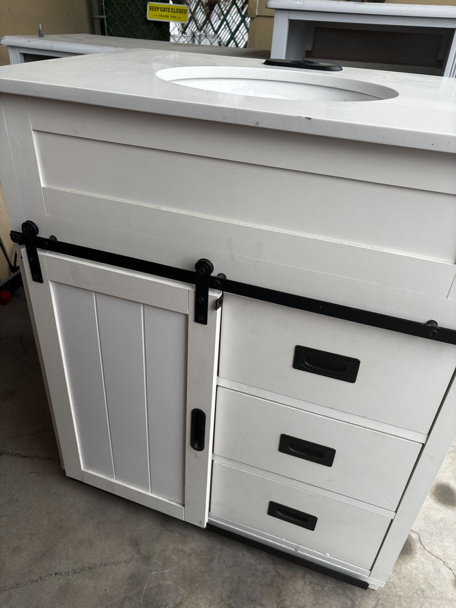 White barn door bathroom vanity and sink