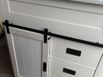 White barn door bathroom vanity and sink