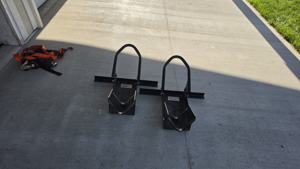 Motorcycle wheel chocks and tie downs